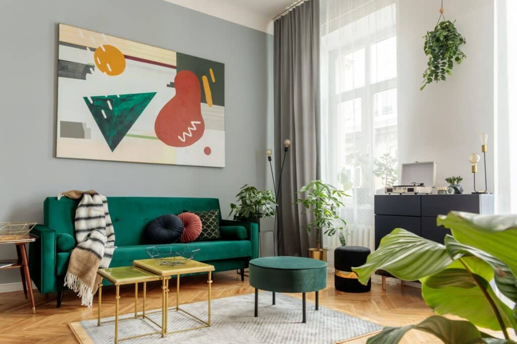 Luxury and modern home interior with design green sofa.