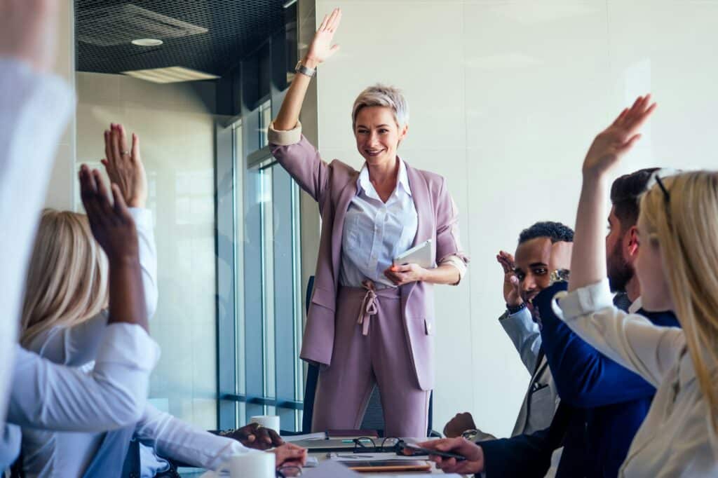 Business lady cheerful smile teacher or mentor, coach speaking in front of group