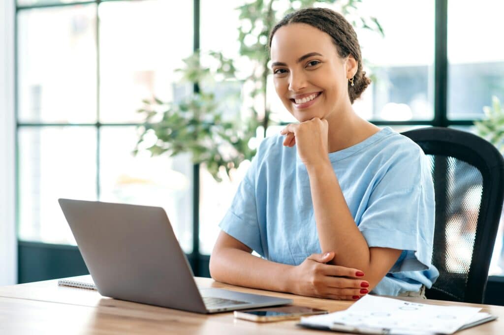 Pretty, friendly young mixed race young woman, business mentor, financial advisor, director, waving